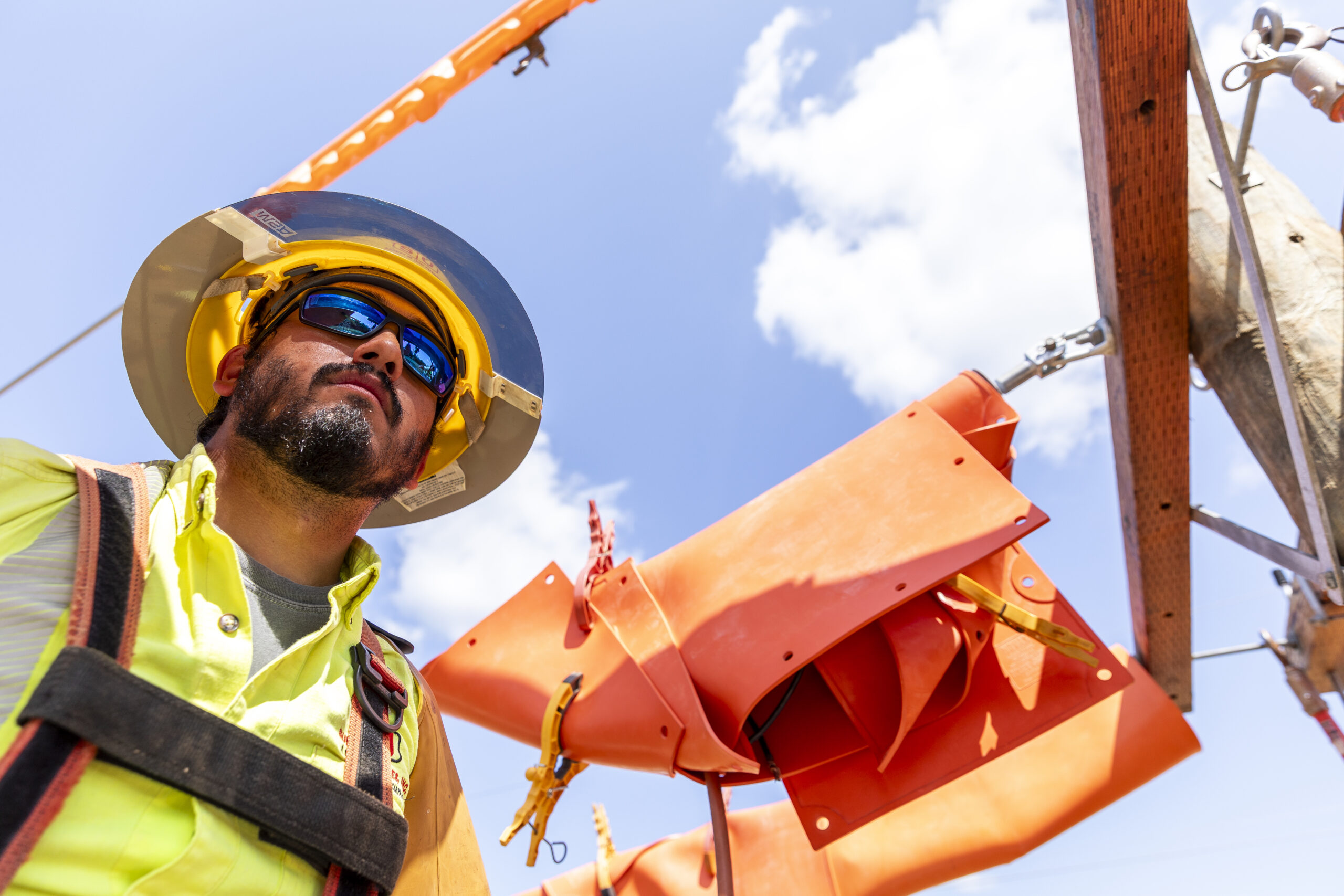Lineman examining the worksite | Northwest Lineman College